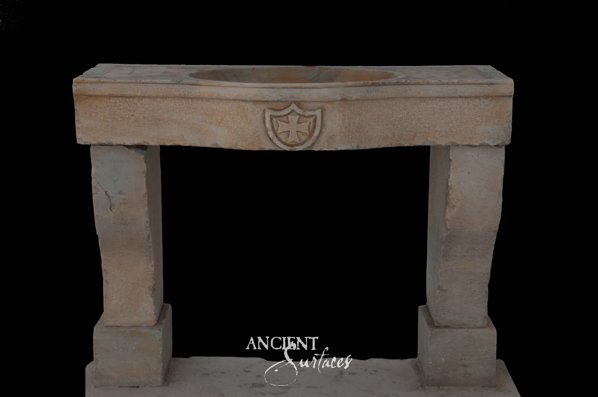 Antique limestone console sink from Ancient Surfaces with a carved Maltese cross shield on the apron